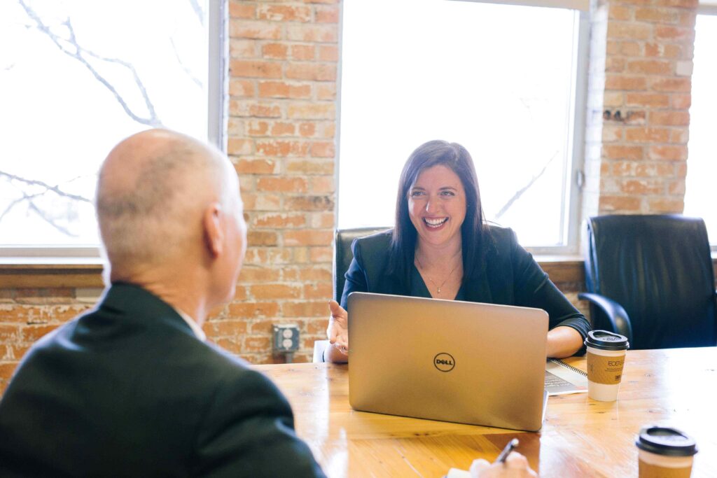 people talking at a conference table