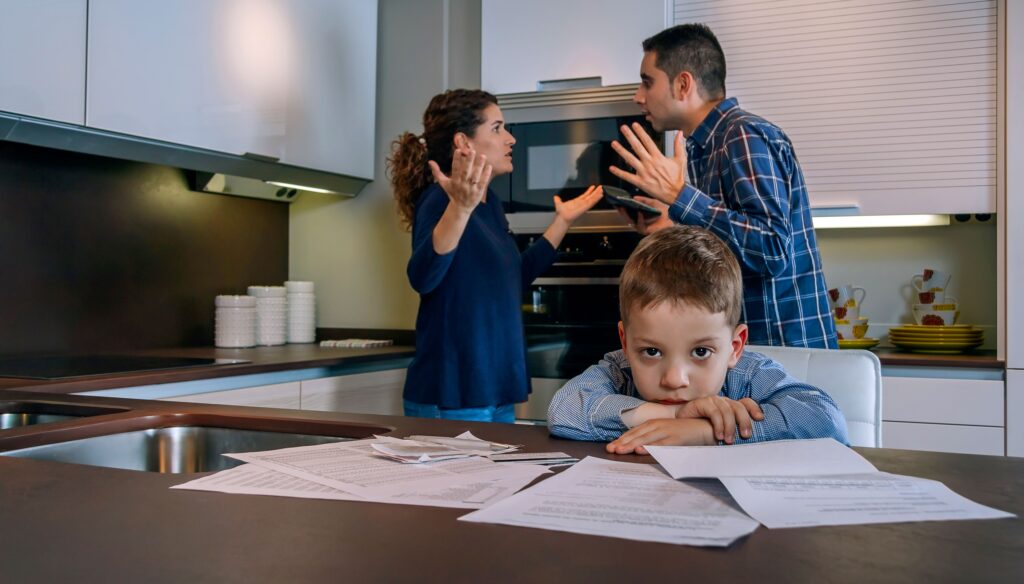parents arguing in front of their small child